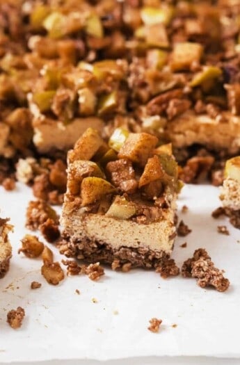 Close-up of a slice of an apple cheesecake bar.