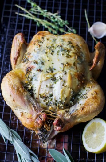 1 Hour Roasted Chicken slathered in a garlic herb butter that will make you swoon. This easy healthy roasted chicken recipe is guaranteed to be a new family favorite! #ad @JustBARE