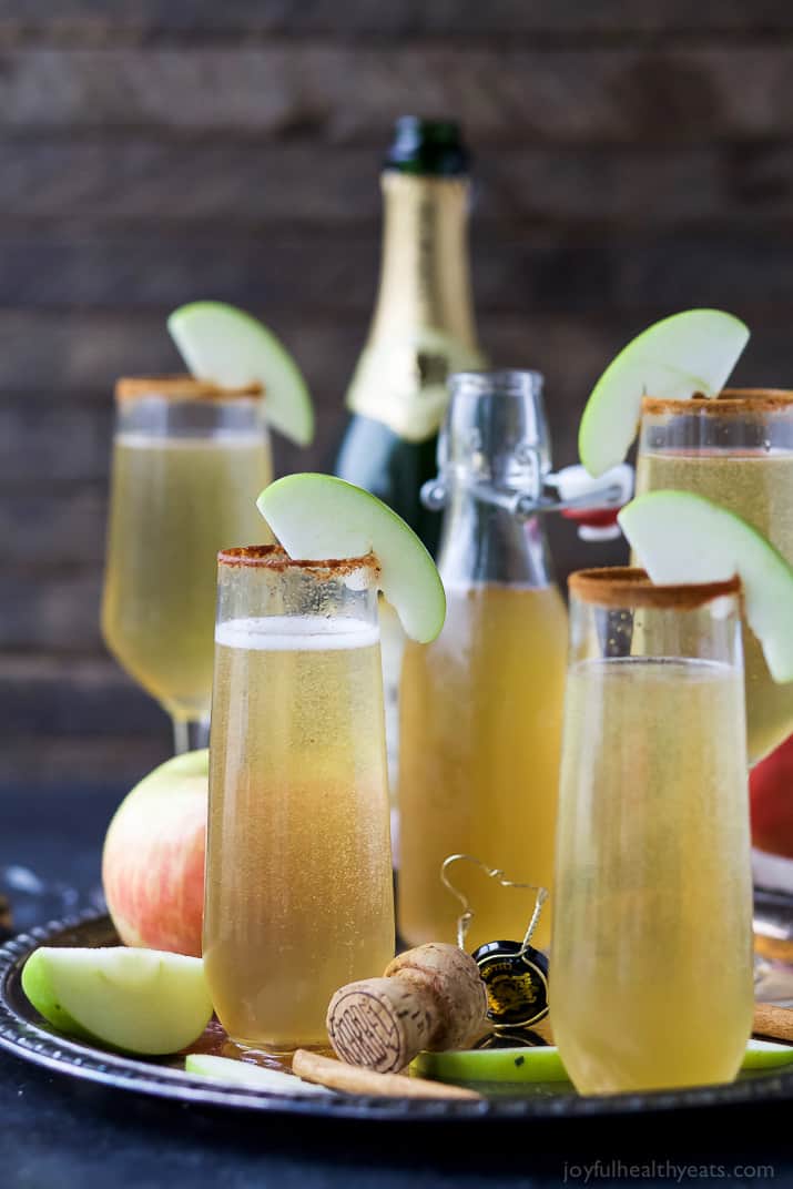Apple cider mimosas on a serving tray