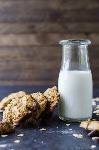 Soft & Chewy Healthy Oatmeal Peanut Butter Cookies dunked in Dark Chocolate - the perfect cookie recipe this holiday season. It's sure to be Santa's favorite!