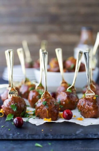 Crock Pot Cranberry BBQ Meatballs - the ultimate appetizer for the holidays. These party meatballs are covered in a sweet spicy Cranberry BBQ sauce that'll make you swoon!