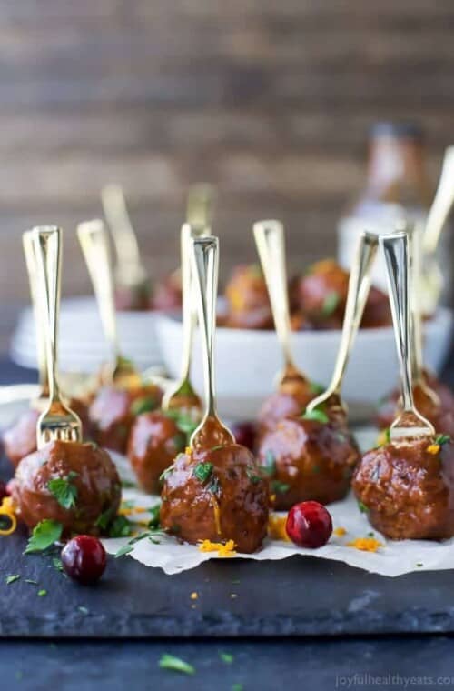 Crock Pot Cranberry BBQ Meatballs - the ultimate appetizer for the holidays. These party meatballs are covered in a sweet spicy Cranberry BBQ sauce that'll make you swoon!