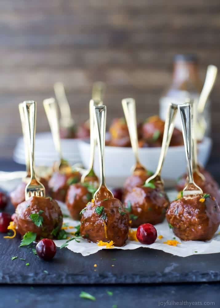 Crock Pot Cranberry BBQ Meatballs - the ultimate appetizer for the holidays. These party meatballs are covered in a sweet spicy Cranberry BBQ sauce that'll make you swoon!