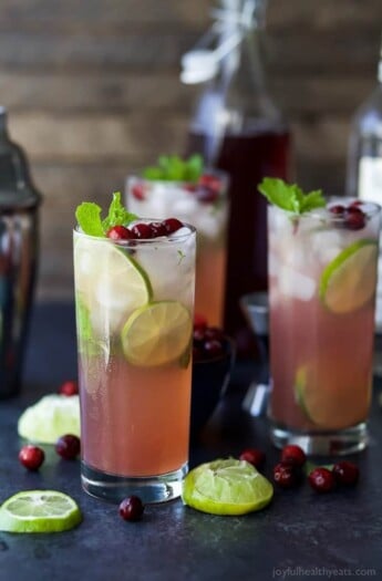 Holiday Cranberry Mojito Recipe made with fresh mint, cranberry and lime juice, agave nectar and rum. An easy party cocktail all made in one pitcher! It's sure to be a hit at your next holiday party!