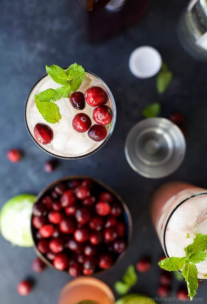 Top view of a glass of Holiday Cranberry Mojito and ingredients