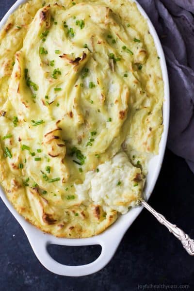 sour cream and chive mashed potatoes in a baking dish