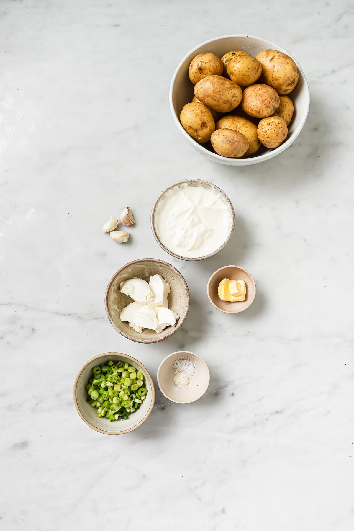 Ingredients for sour cream and chive mashed potatoes. 