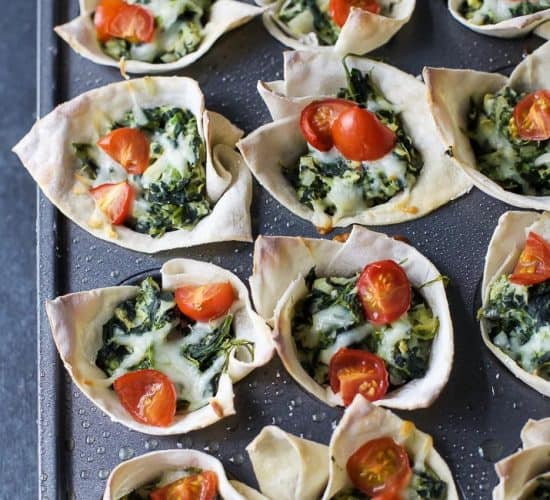 Easy Baked Wonton Bites filled with homemade Spinach Artichoke Dip - a delicious healthy appetizer perfect for entertaining a large crowd. 