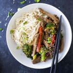Easy 20 Minute Beef and Broccoli Stir Fry Recipe with tender steak, crunchy veggies and a sweet & spicy sauce you'll love! Forget takeout, this quick gluten free stir fry will be your new go to dinner!