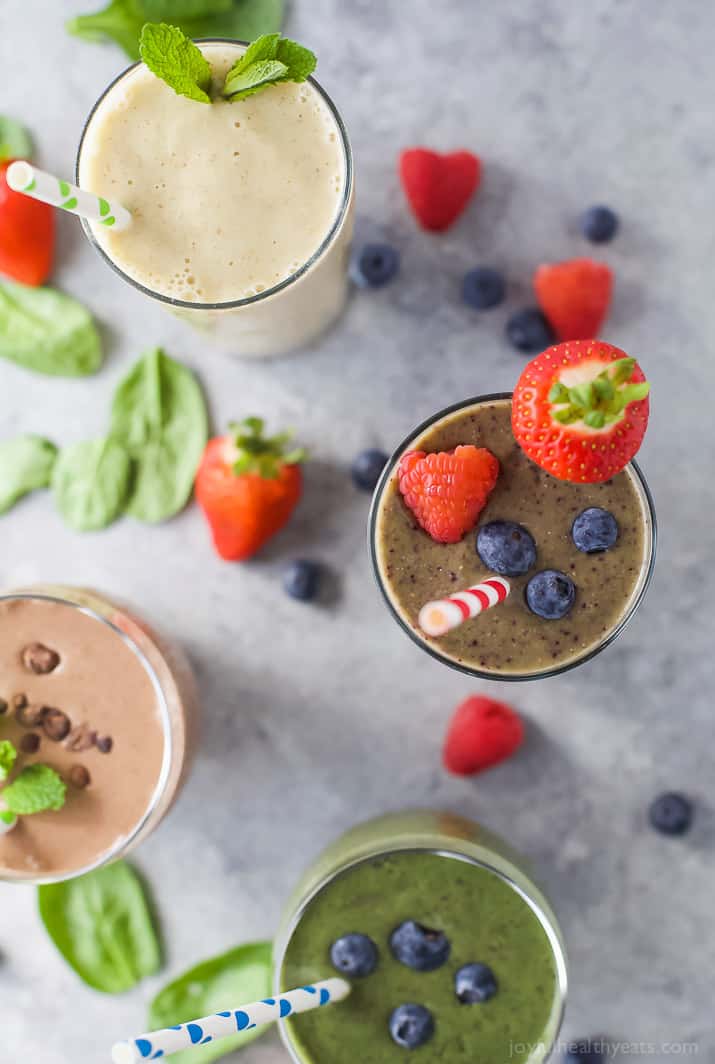 Top view of 4 different smoothies in glasses