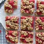 Fresh Almond Oat Raspberry Bars with a delicious crumble topping! These Raspberry Bars are sweet, tart, totally satisfying and guilt free at 129 calories a bar! {gluten free, dairy free, and vegan}