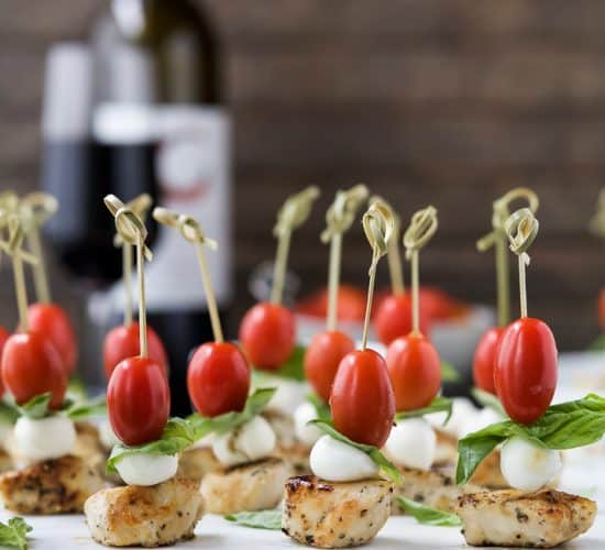 Easy Caprese Chicken Skewers drizzled with a homemade Balsamic Glaze absolutely irresistible and make the ULTIMATE party appetizer! Just watch these gluten free caprese bites disappear from the appetizer table! #ad