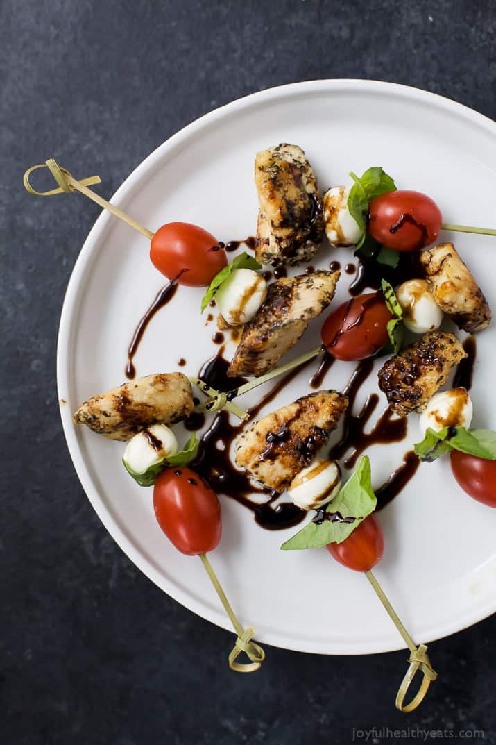 Caprese Chicken Skewers drizzled with a homemade Balsamic Glaze on a plate