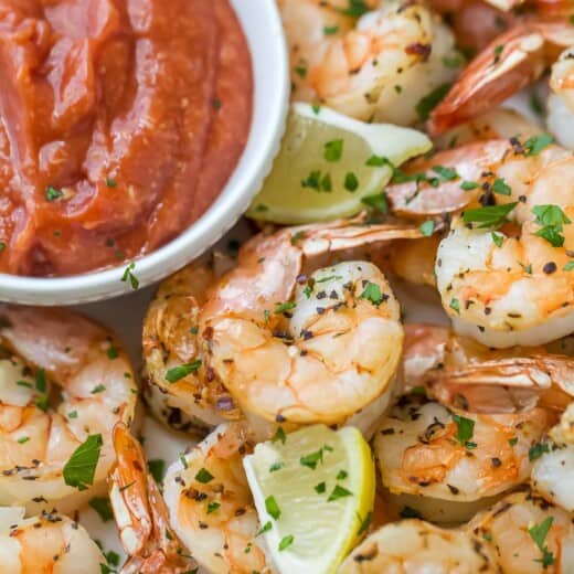 Shrimp with homemade sauce and a lemon wedge.