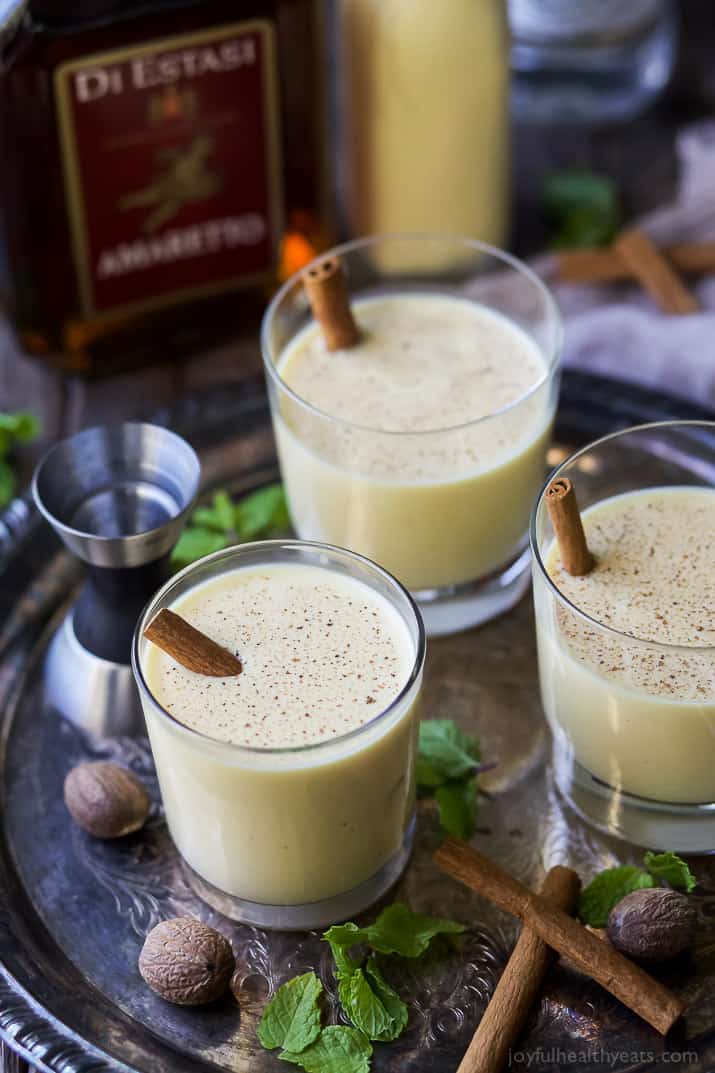 Dairy Free Holiday Spiked Eggnog with Amaretto and White Rum - a delicious creamy cocktail for the holidays. This Spiked Eggnog is a boozy treat perfect for a crowd!