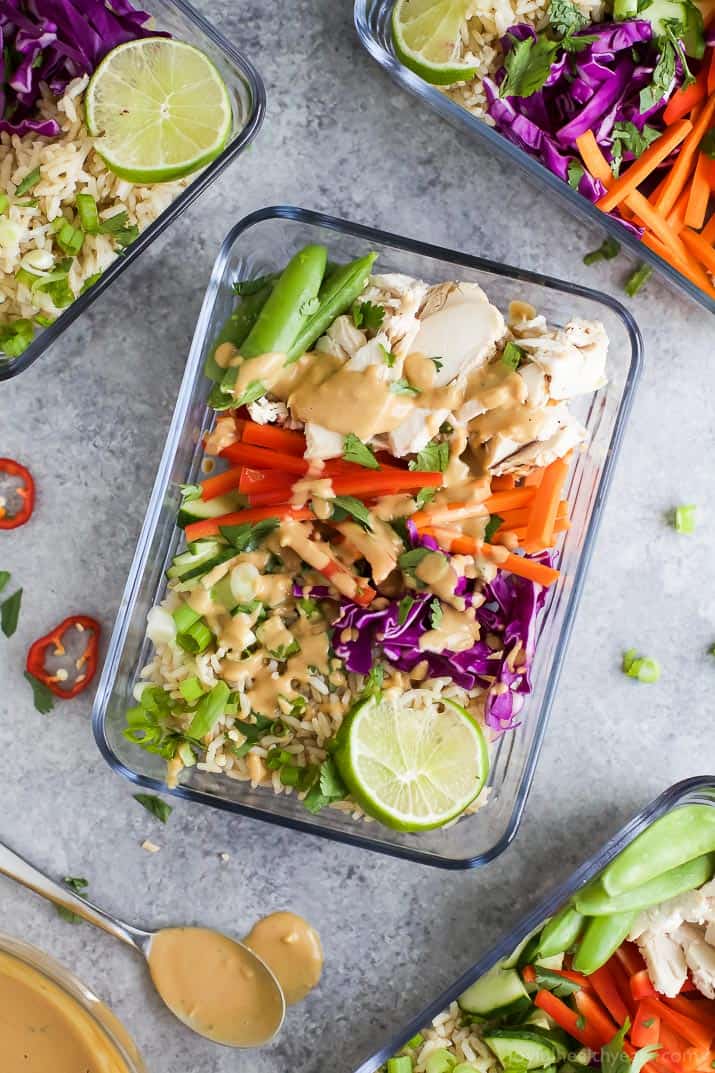 Easy Thai Chicken Grain Bowl drizzled with a Creamy Peanut Dressing. These Grain Bowls are filled with veggies, thai flavors, 17 grams of protein and come together in 15 minutes. The perfect start to a healthy new year! {gluten free}