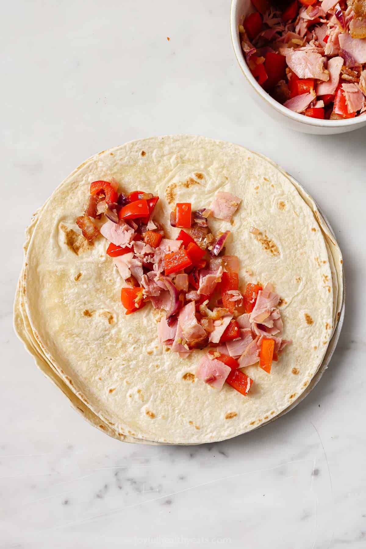 Filling the tortillas. 