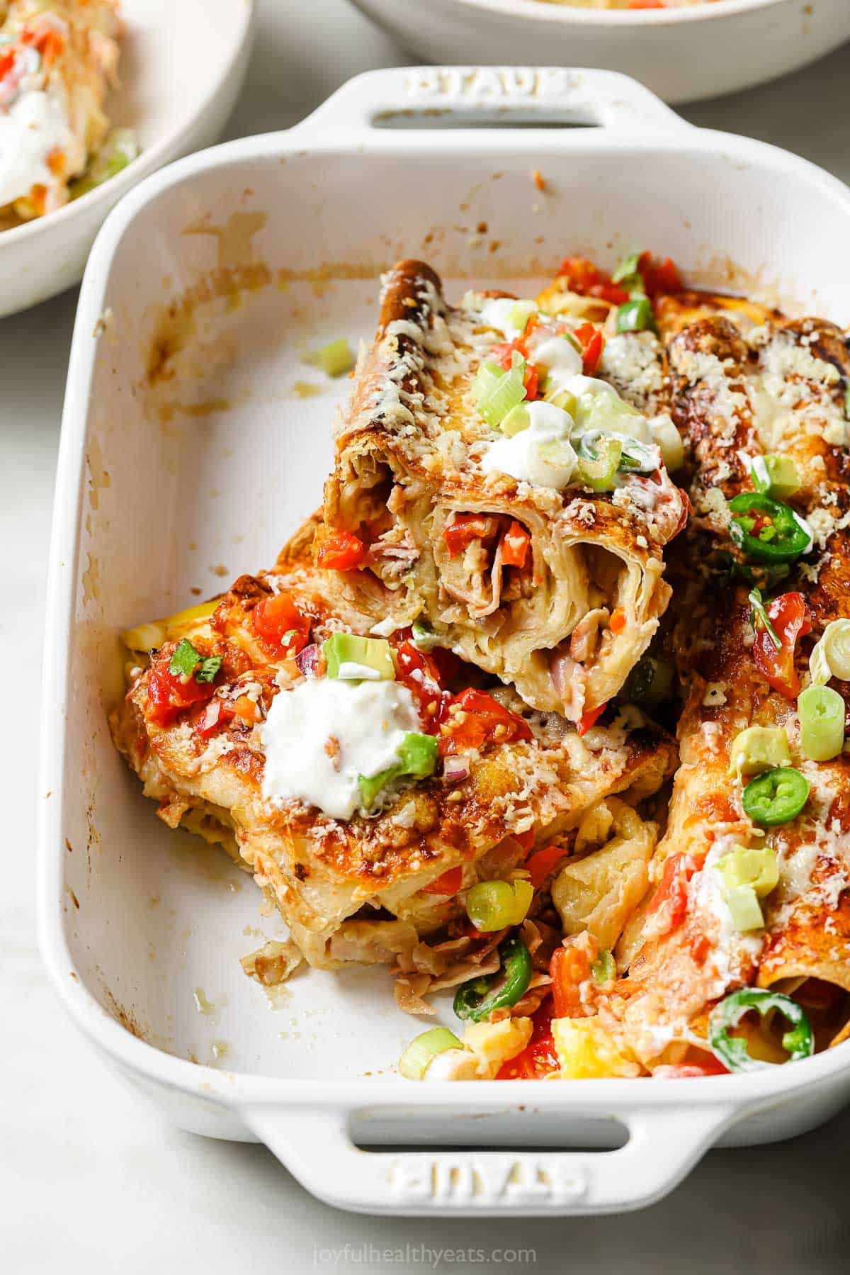 Close-up of enchiladas in the baking dish. 