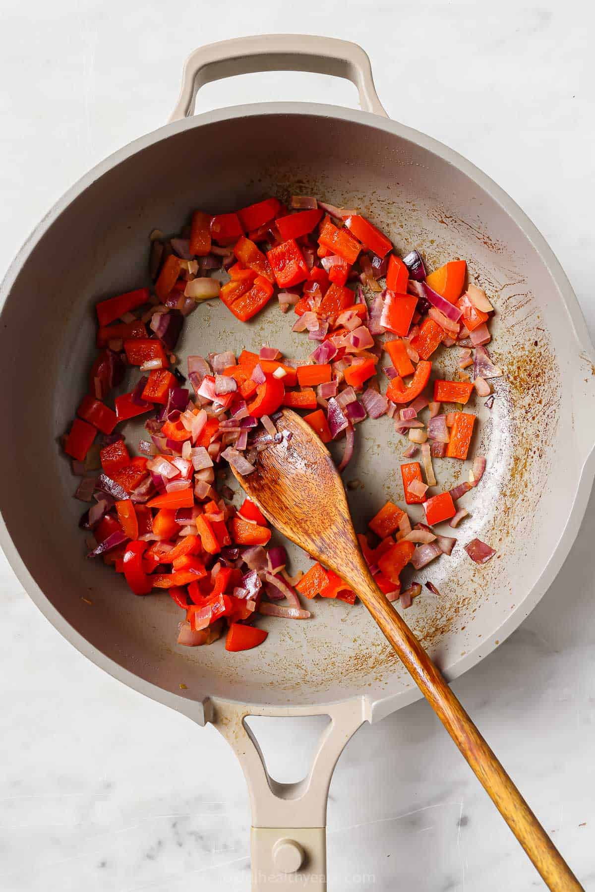 Cooking the veggies in the skillet. 