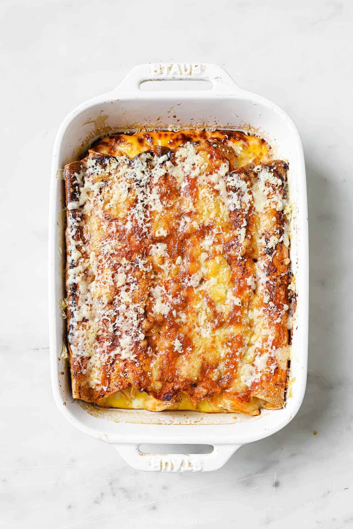 Baked enchiladas in the baking dish. 