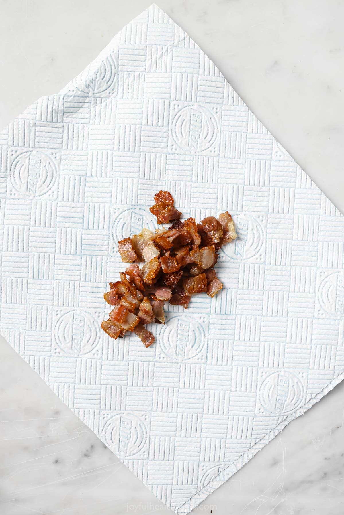 Browned bacon on a paper-towel. 
