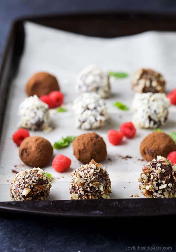 Easy Paleo Raspberry Chocolate Truffles using only 4 ingredients. Rich, decadent and everything you want in a chocolate truffle. The perfect healthy dessert for the holidays!