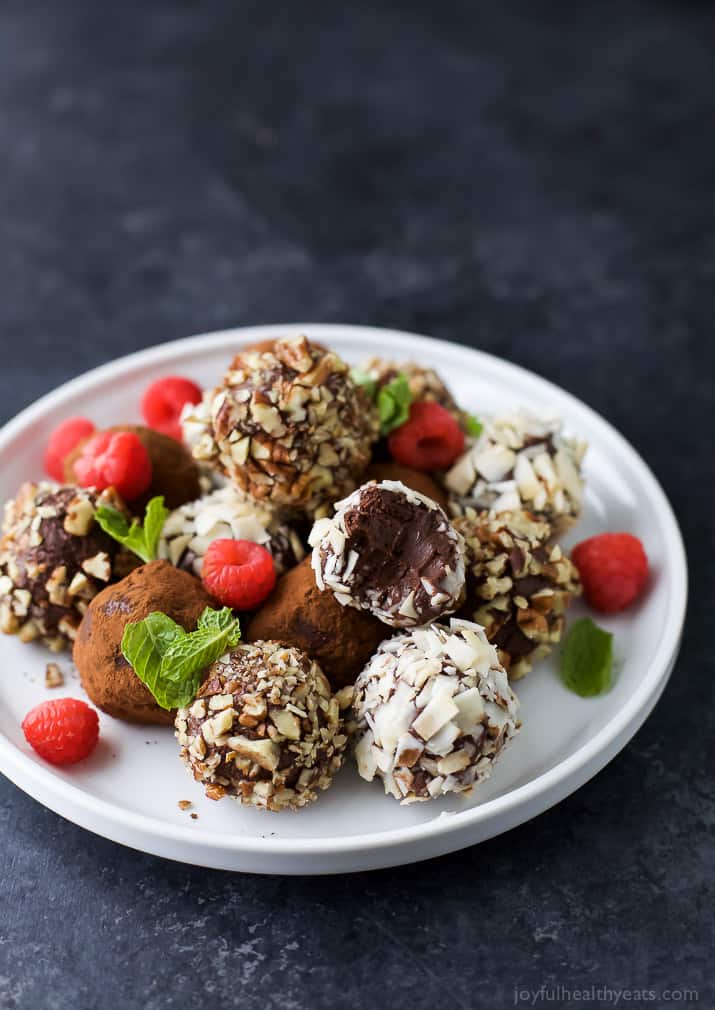 Easy Paleo Raspberry Chocolate Truffles using only 4 ingredients. Rich, decadent and everything you want in a chocolate truffle. The perfect healthy dessert for the holidays!