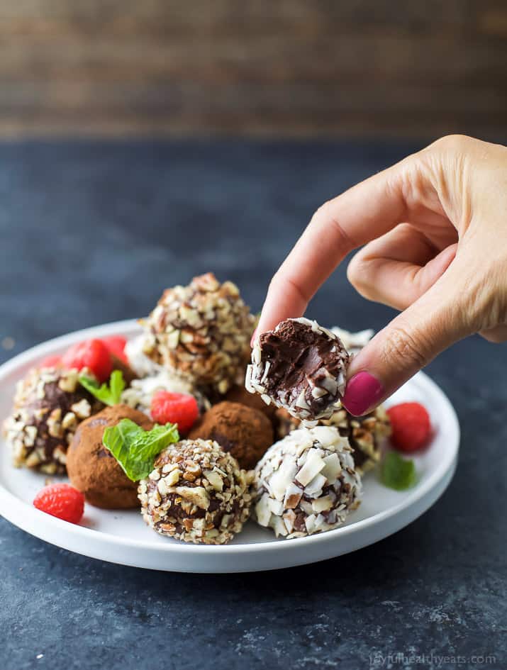 Easy Paleo Raspberry Chocolate Truffles using only 4 ingredients. Rich, decadent and everything you want in a chocolate truffle. The perfect healthy dessert for the holidays!