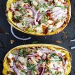 Easy Low Carb BBQ Chicken Pizza Stuffed Spaghetti Squash - filled with sweet tangy BBQ sauce, 22 grams of protein and gooey cheese. All your favorite things about BBQ Chicken Pizza for under 300 calories! #glutenfree