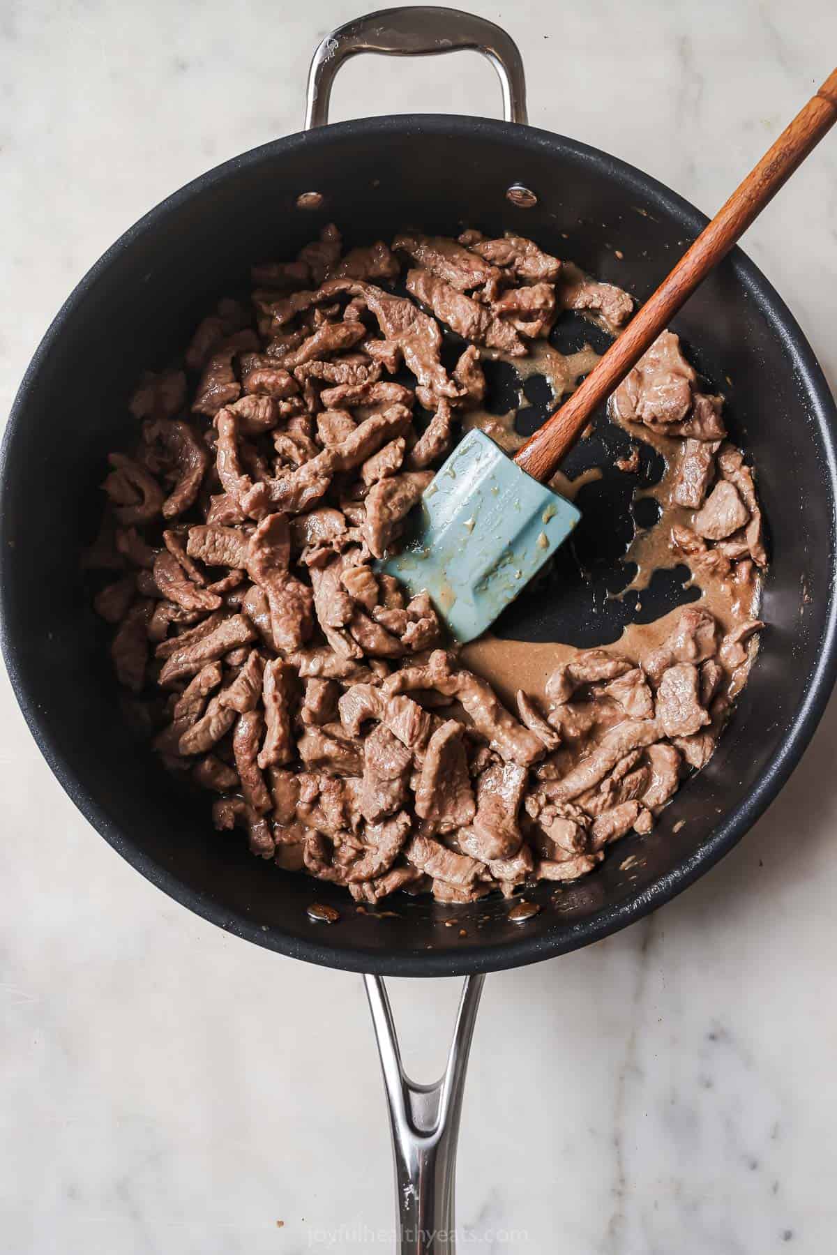 Beef in a large skillet.