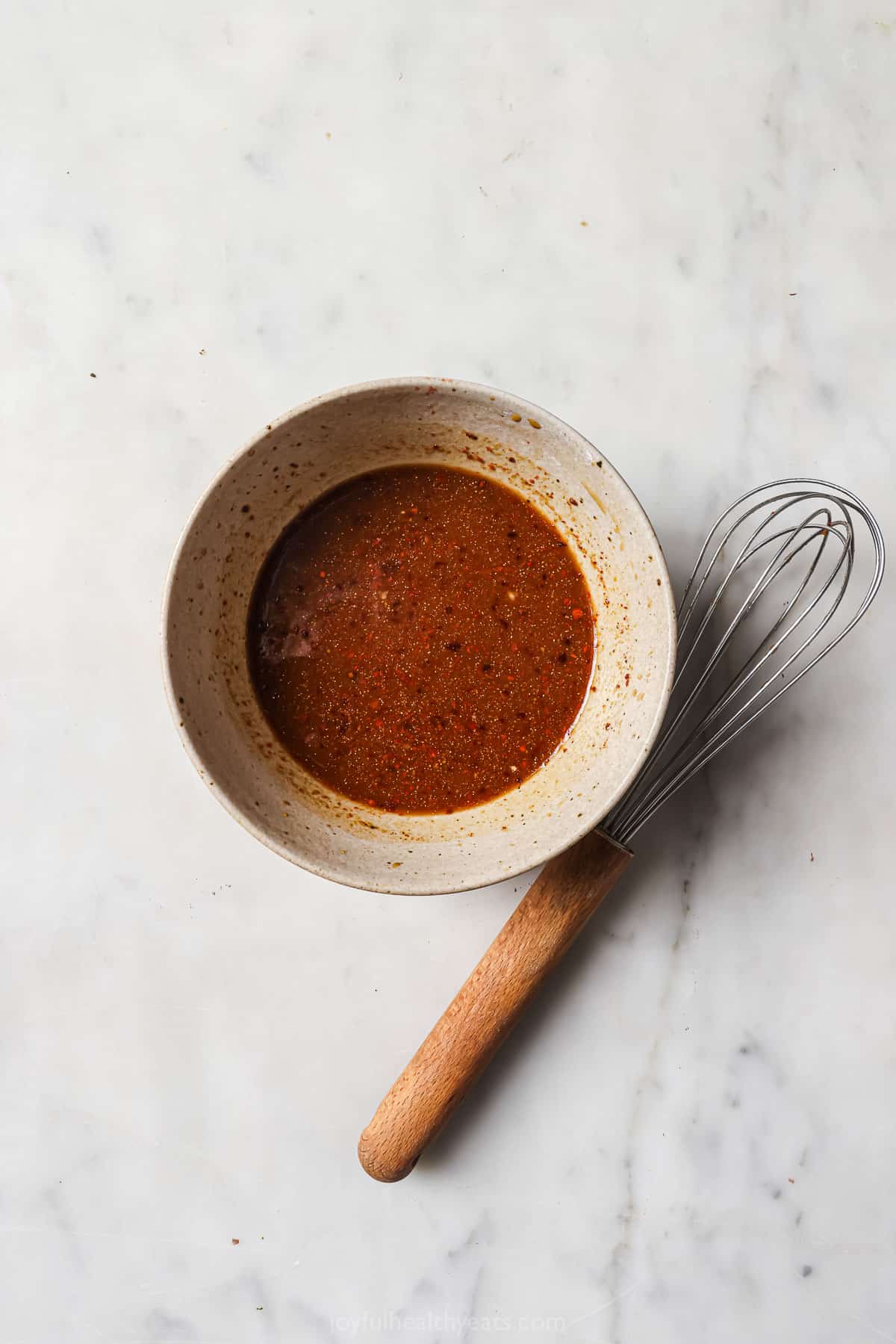 Sweet-and-،y sauce in a bowl. 