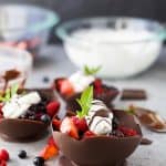 DIY Chocolate Bowls made with balloons that are filled with fresh berries and topped with a dairy free Coconut Whipped Cream. These Chocolate Bowls are the perfect light and refreshing Valentines Day dessert.