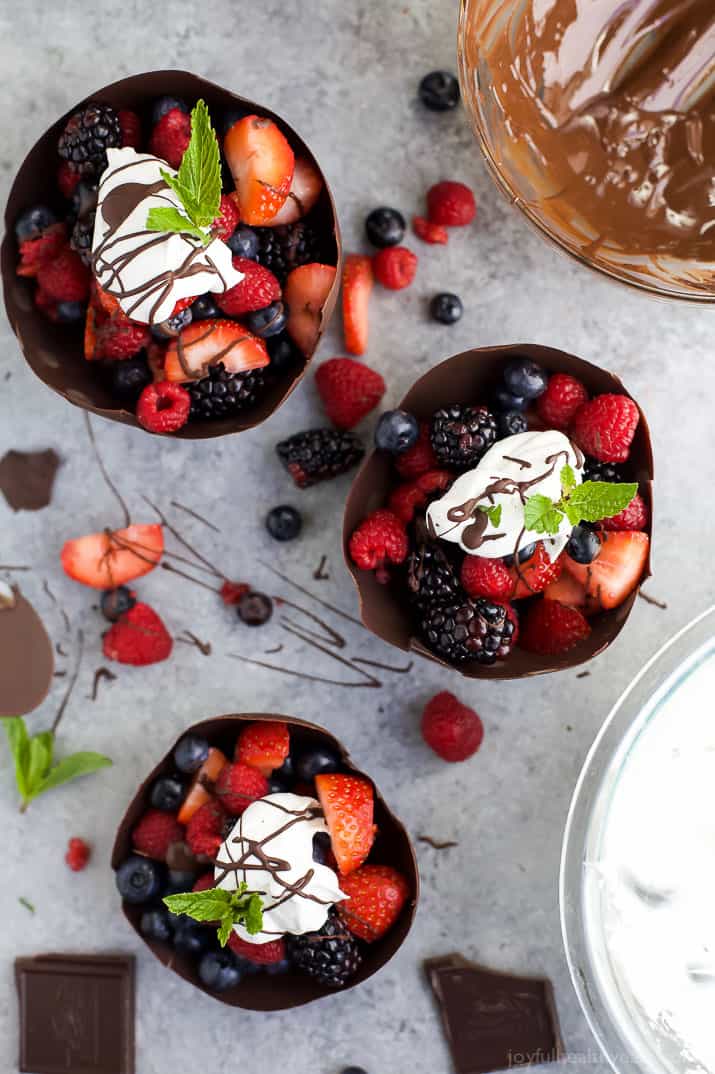 Top view of DIY Chocolate Bowls filled with fresh berries and topped with Coconut Whipped Cream