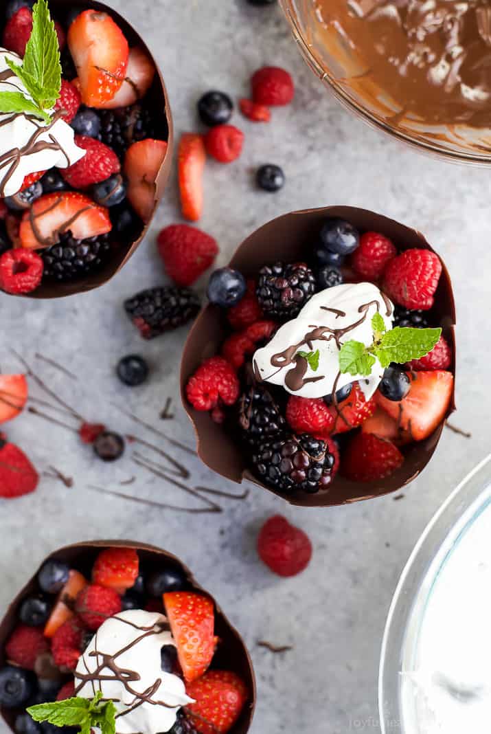 Top view of DIY Chocolate Bowls filled with fresh berries and topped with Coconut Whipped Cream