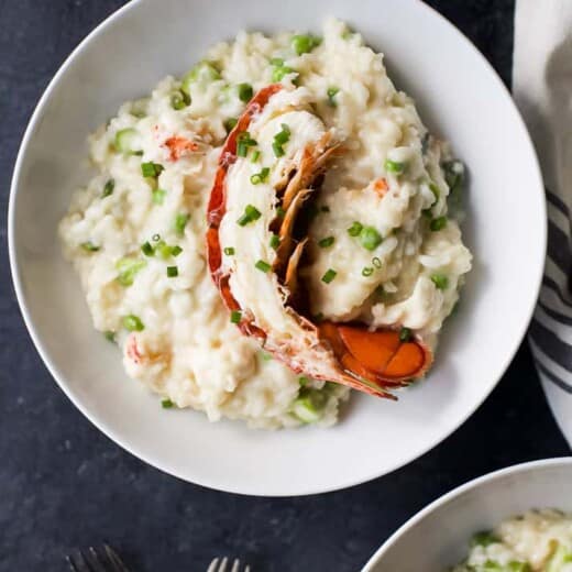 Creamy Lobster Risotto, a luscious pasta dinner filled with chunks of buttery lobster, asparagus and sweet peas. The perfect dinner for Valentines Day or a fancy Date Night in.