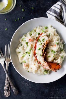 creamy lobster risotto recipe in a bowl with a lobster tail on top