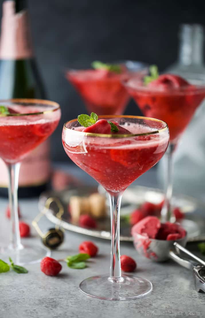 Raspberry Sorbet Rosé Floats - an fun beautiful cocktail to serve on Valentines Day or a ladies brunch! Made with raspberry sorbet, Rosé and vanilla vodka!