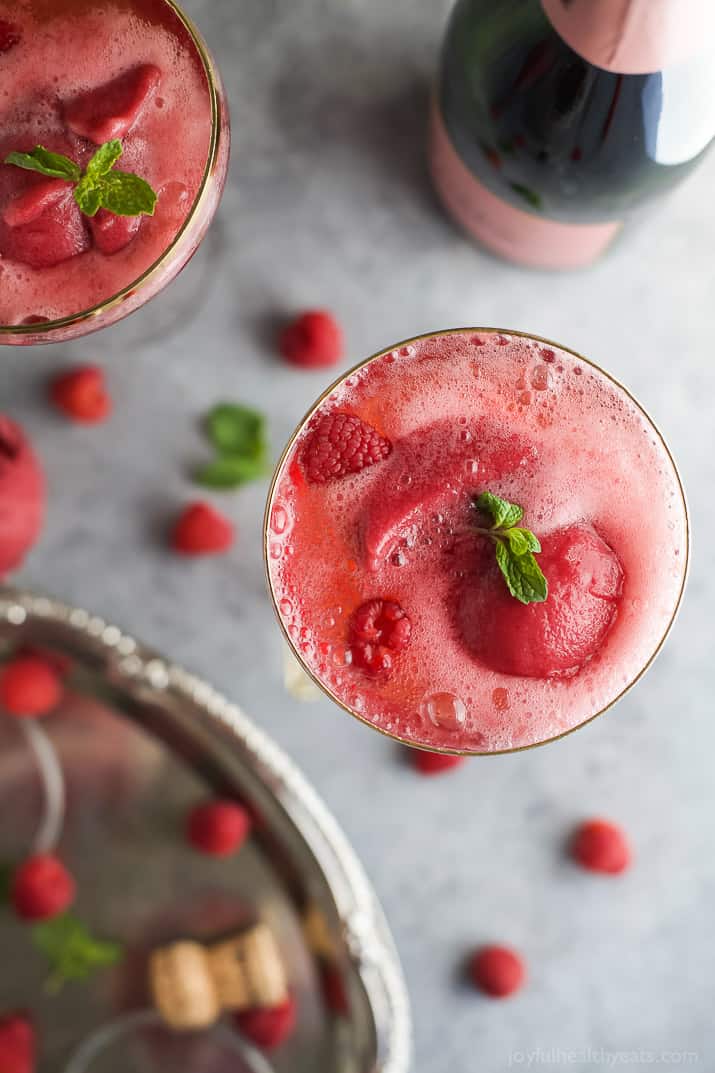 Raspberry Sorbet Rosé Floats - a fun beautiful cocktail to serve on Valentines Day or a ladies brunch! Made with raspberry sorbet, Rosé and vanilla vodka!