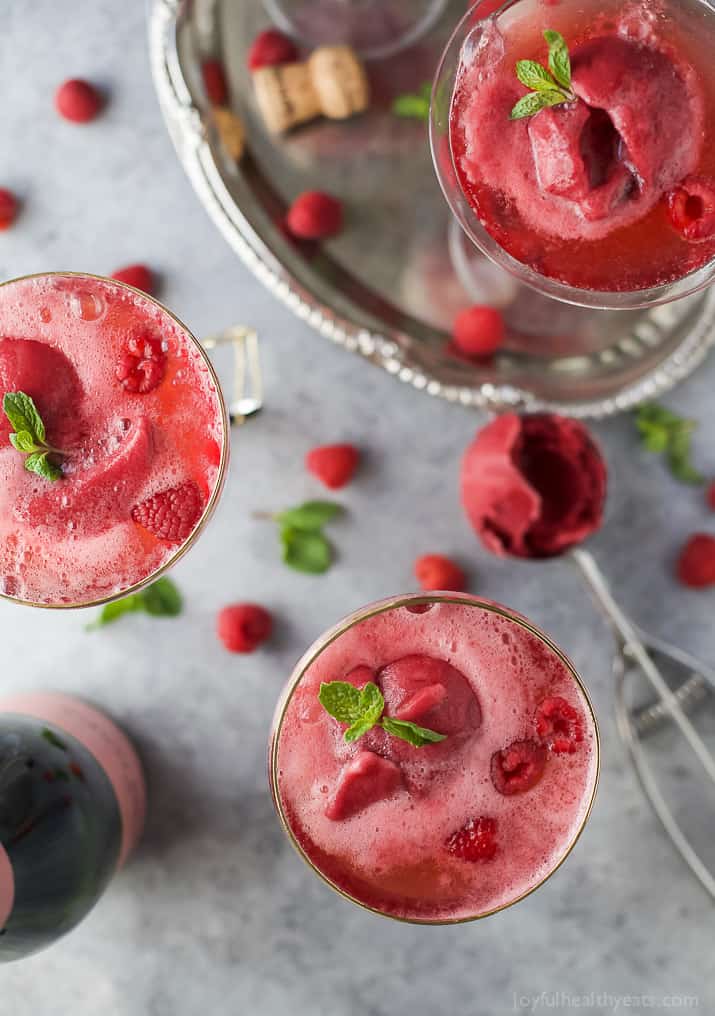 Raspberry Sorbet Rosé Floats - a fun beautiful cocktail to serve on Valentines Day or a ladies brunch! Made with raspberry sorbet, Rosé and vanilla vodka!