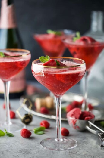 Raspberry Sorbet Rosé Floats - a fun beautiful cocktail to serve on Valentines Day or a ladies brunch! Made with raspberry sorbet, Rosé and vanilla vodka!