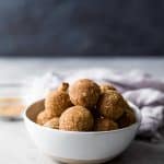 These easy Snickerdoodle Energy Balls are made in a blender and then rolled in a cinnamon coconut sugar crust. They taste just like snickerdoodle cookies and are the perfect breakfast, post workout snack or late night treat. #ad