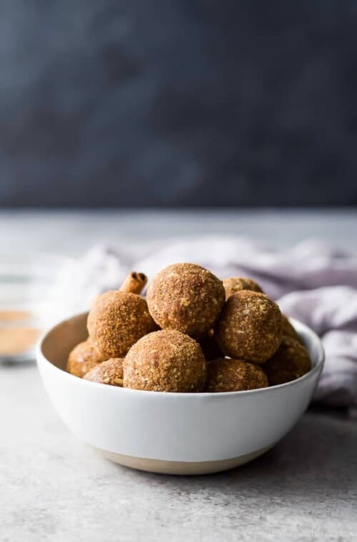 These easy Snickerdoodle Energy Balls are made in a blender and then rolled in a cinnamon coconut sugar crust. They taste just like snickerdoodle cookies and are the perfect breakfast, post workout snack or late night treat. #ad