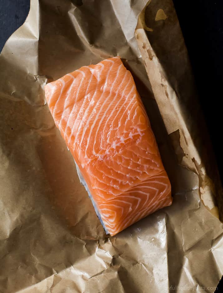 Raw salmon fillet in butcher paper