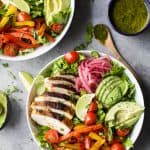 30 Minute Chicken Fajita Salad with fresh veggies, chipotle chicken, creamy avocado then topped with a zesty Chimichurri Dressing. This Chicken Fajita Salad is one flavorful dinner recipe that's sure to please any crowd.