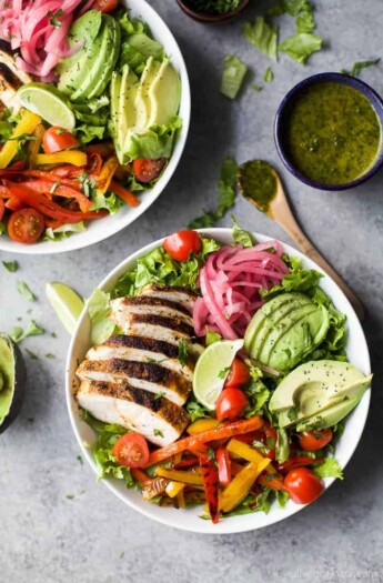 30 Minute Chicken Fajita Salad with fresh veggies, chipotle chicken, creamy avocado then topped with a zesty Chimichurri Dressing. This Chicken Fajita Salad is one flavorful dinner recipe that's sure to please any crowd.