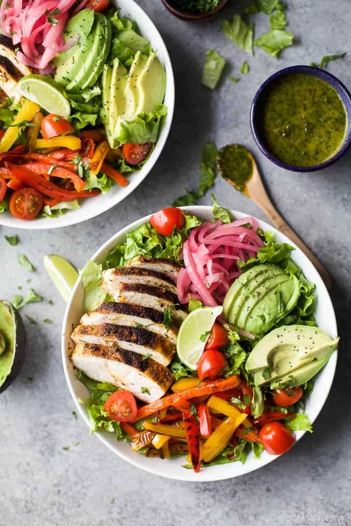 30 Minute Chicken Fajita Salad with fresh veggies, chipotle chicken, creamy avocado then topped with a zesty Chimichurri Dressing. This Chicken Fajita Salad is one flavorful dinner recipe that's sure to please any crowd.