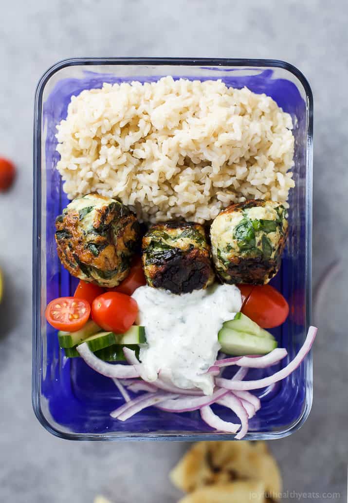 Top view of Gyro Turkey Meatball Grain Bowl with rice, vegetables and a creamy Tzatziki sauce