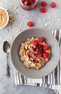 A healthy Peanut Butter & Jelly Oatmeal Recipe that creamy, delicious, high in protein and fiber and takes less than 15 minutes to make! You'll be making this for breakfast every morning after you try it!
