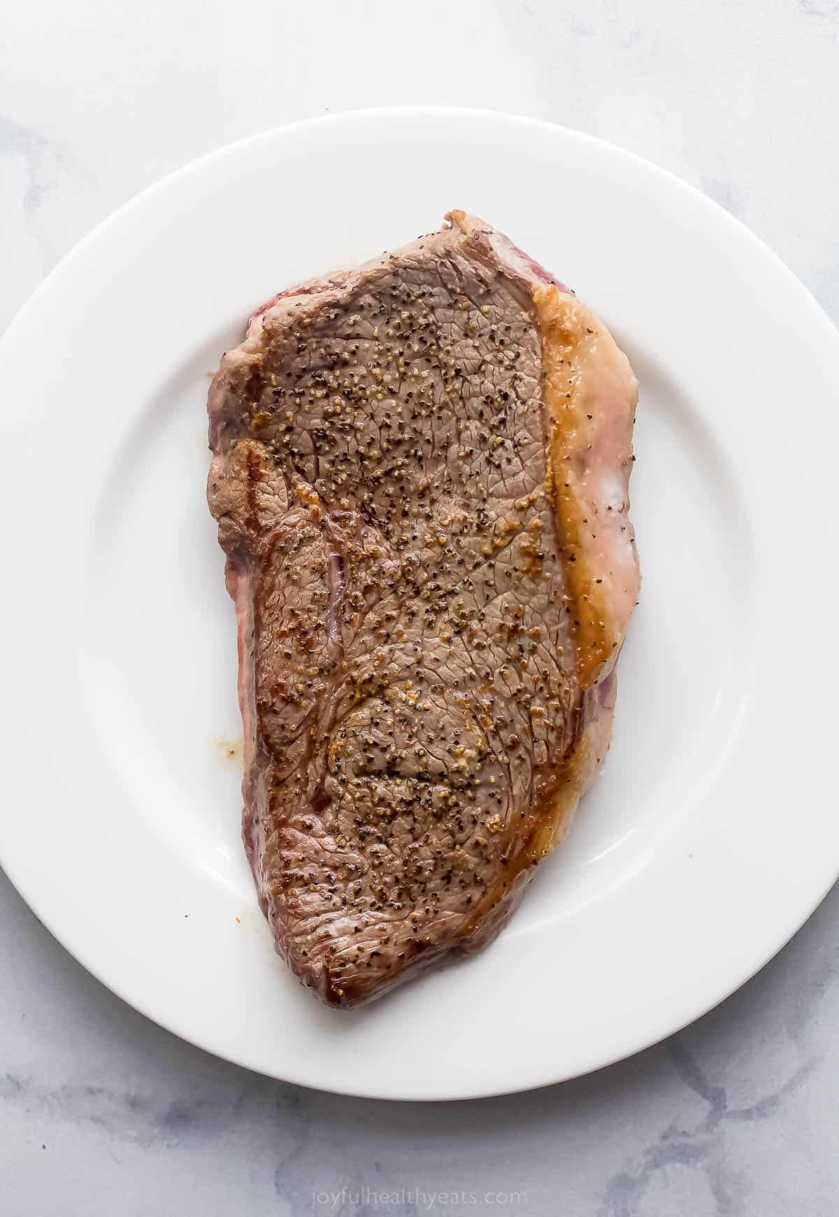 a cooked steak on a plate