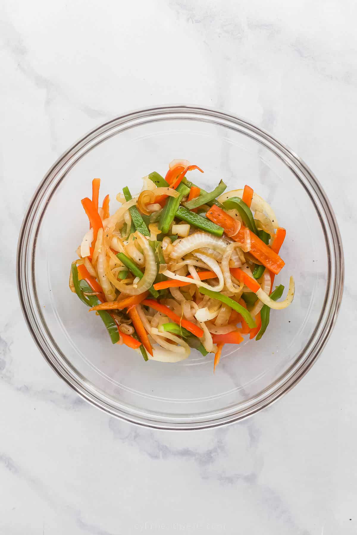 sliced vegetables in a glass bowl